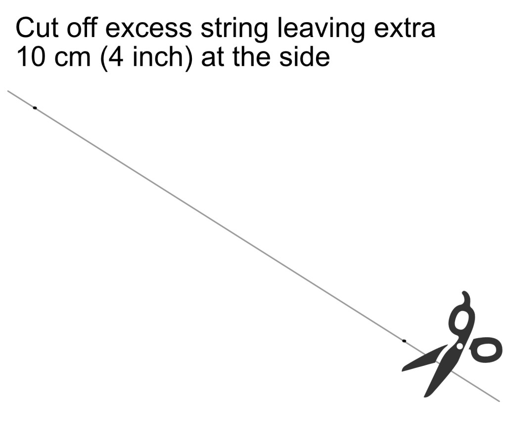 Cutting away excess string with scissors.