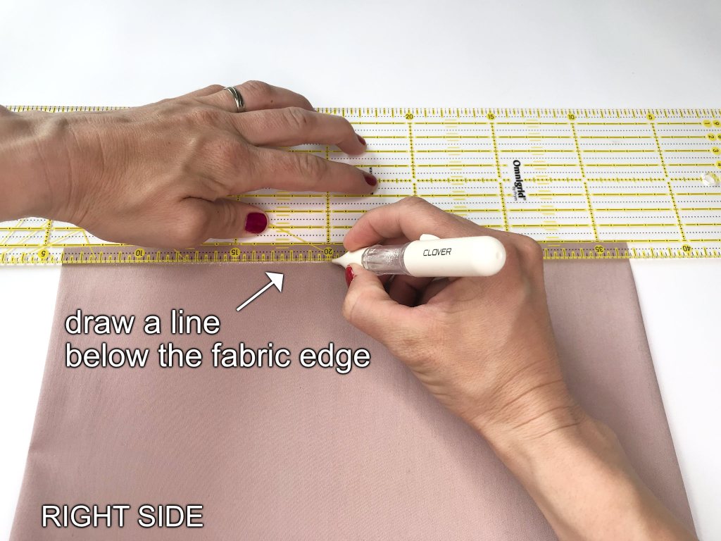 Draw a line below the raw edge of the skirt waist.