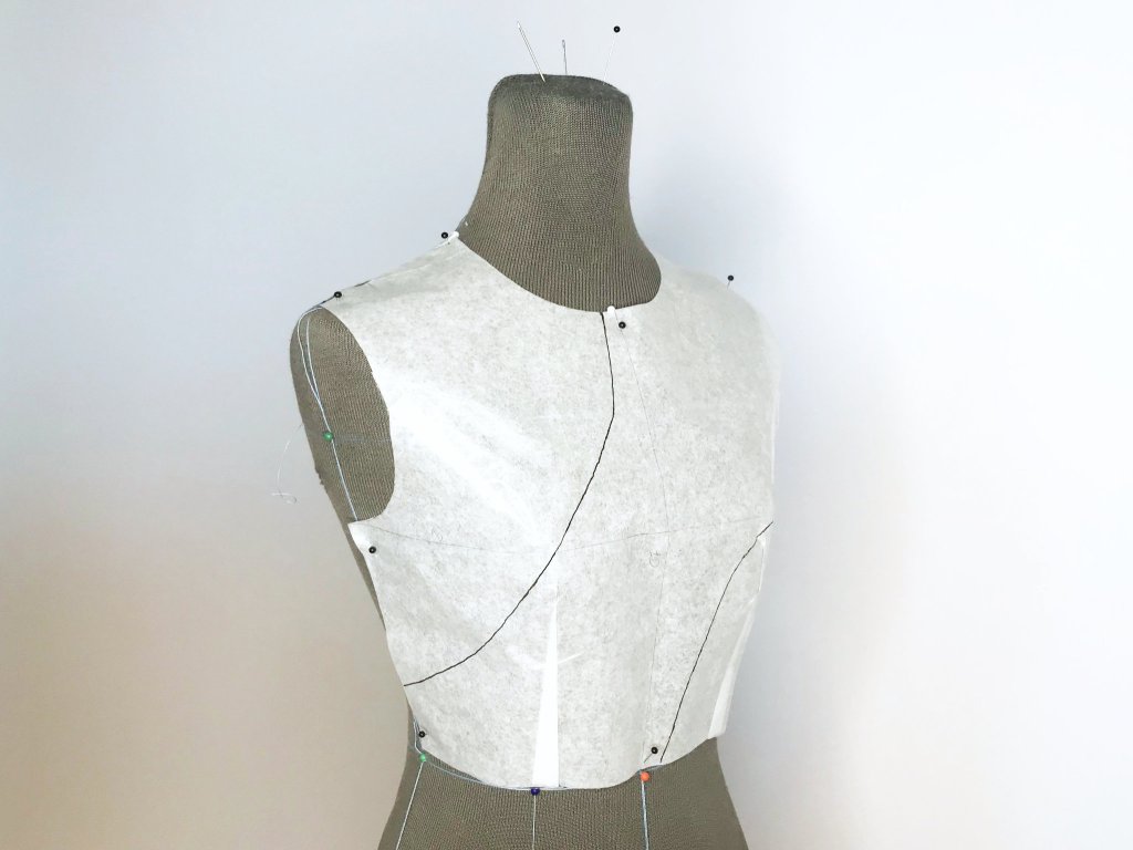 Asymmetric pattern design on a half size tailors dummy.