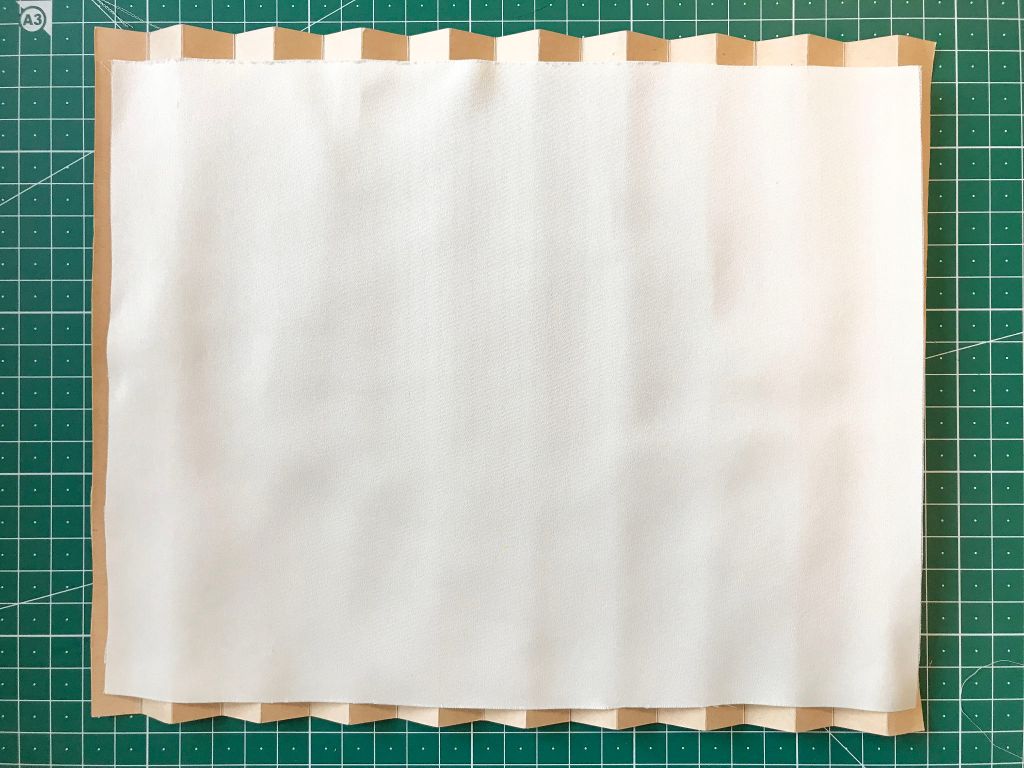 Polyester fabric placed on the bottom  pleating mould.
