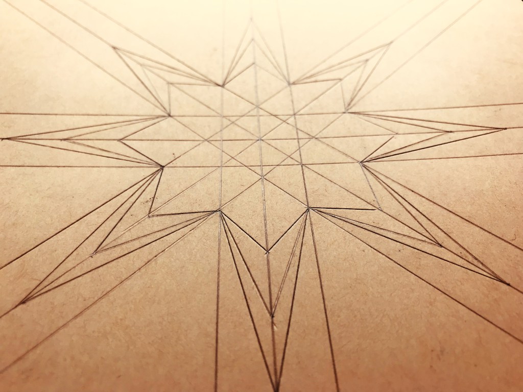 Pre-pressed lines of a star on a kraft paper.