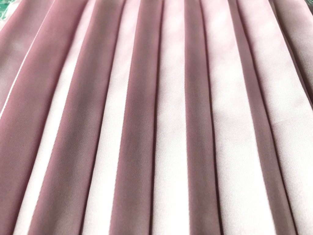 Hand pleated satin fabric after being wrinkled and washed.
