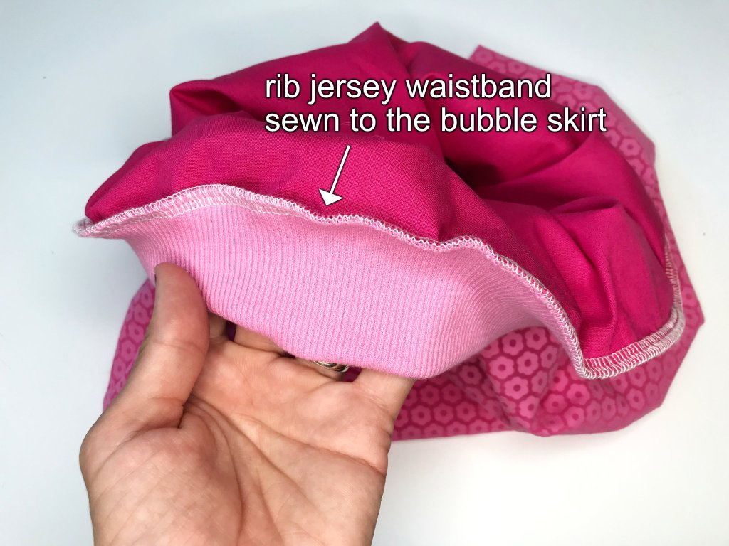 A rib jersey elastic waistband casing sewn to a ballon skirt waist.