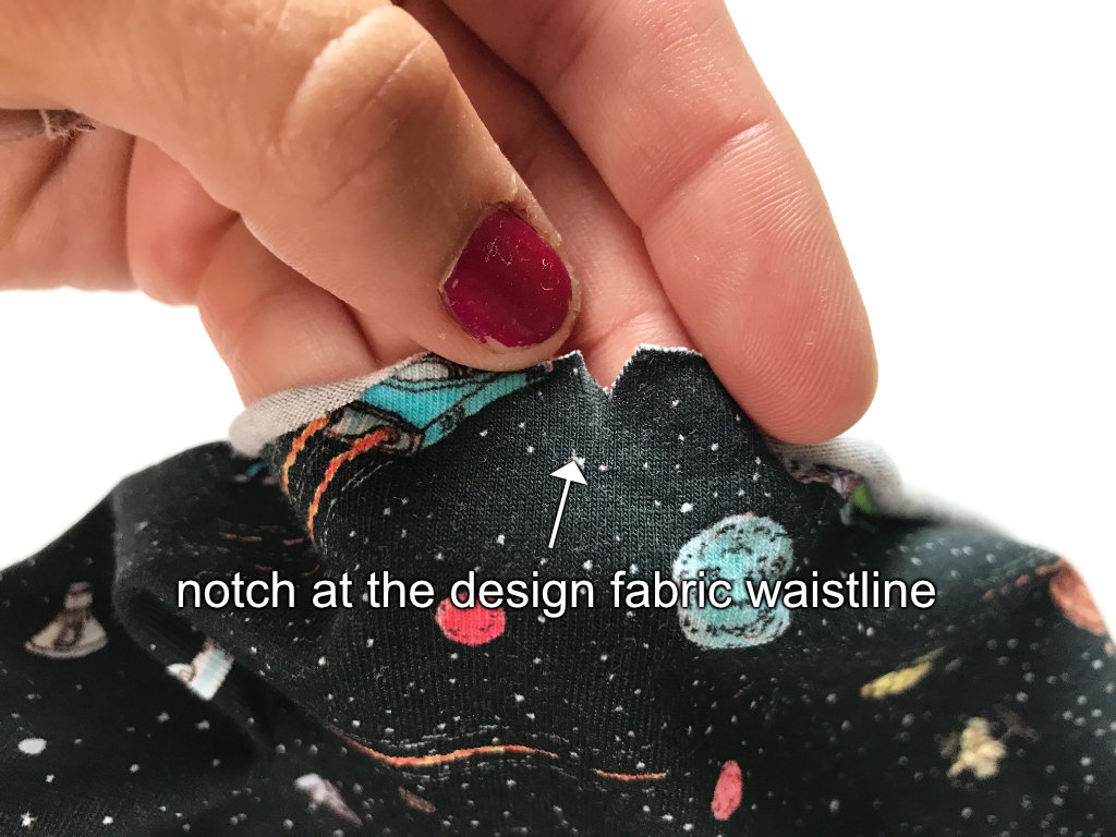 Notch on a fabric with space pattern.