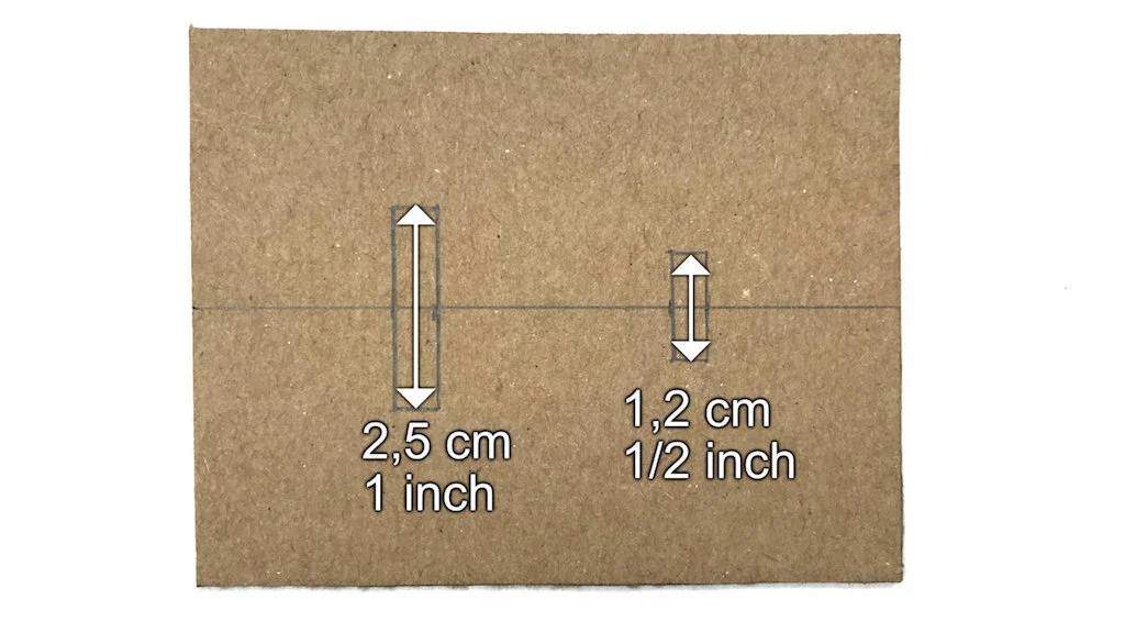 Center line of cardboard tape maker with markings for openings.