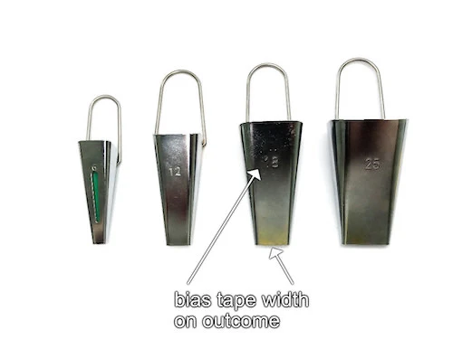 Set of different bias tape makers.