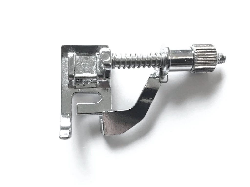 Blind stitch presser foot for sewing blind stitch and for topstitching.