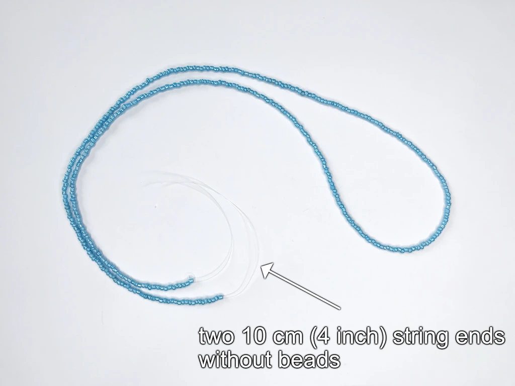One nylon cord completely beaded with light blue beads.