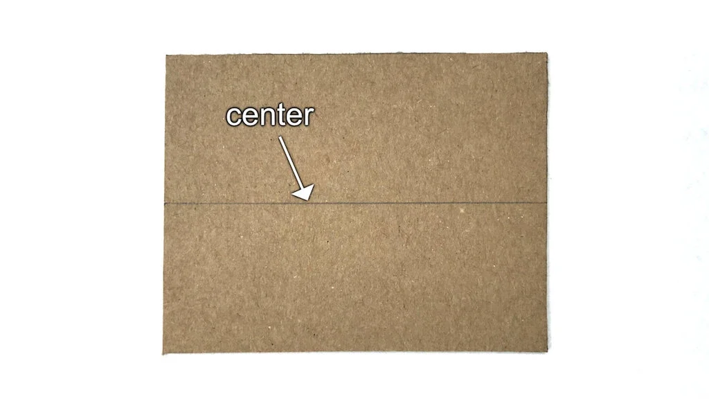 Center line of cardboard where the input and output holes will be cut.