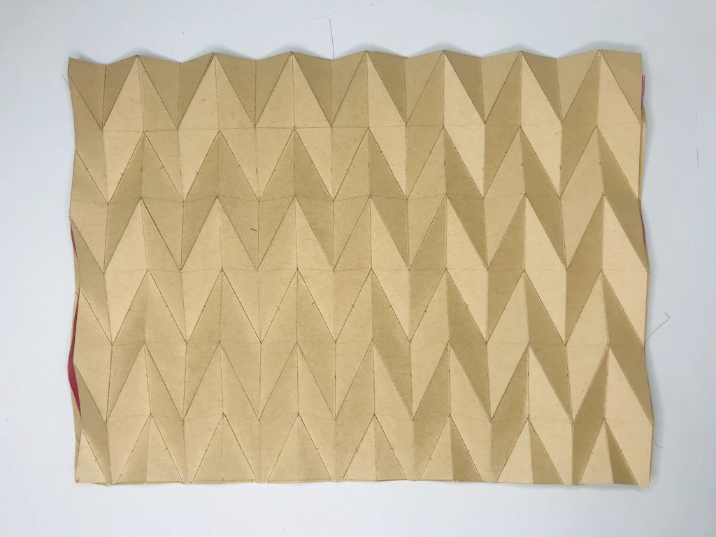 Chiffon fabric prepared to be hand pleated.