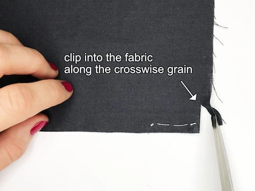 Clipping into the fabric along the crossgrain.
