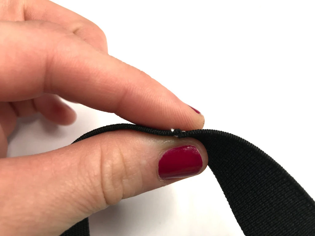 Ends of an elastic waistband basted together.