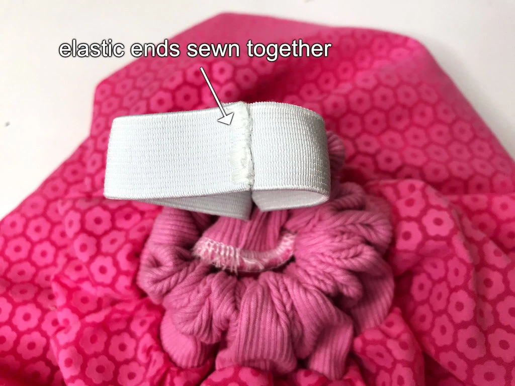 Elastic band ends sewing together with a dense zigzag stitch.