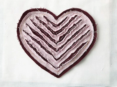 A scary version of faux chenille heart applique.