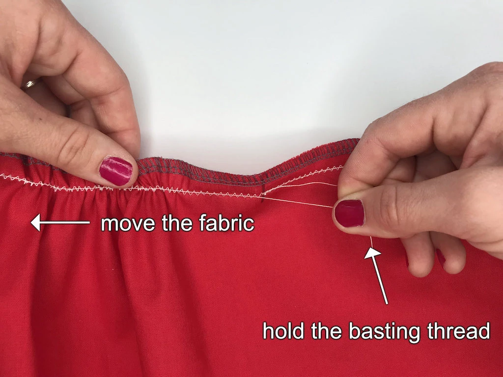 End of fabric with secured zig-zag stitch and at least 10 cm (4 inch) basting thread.