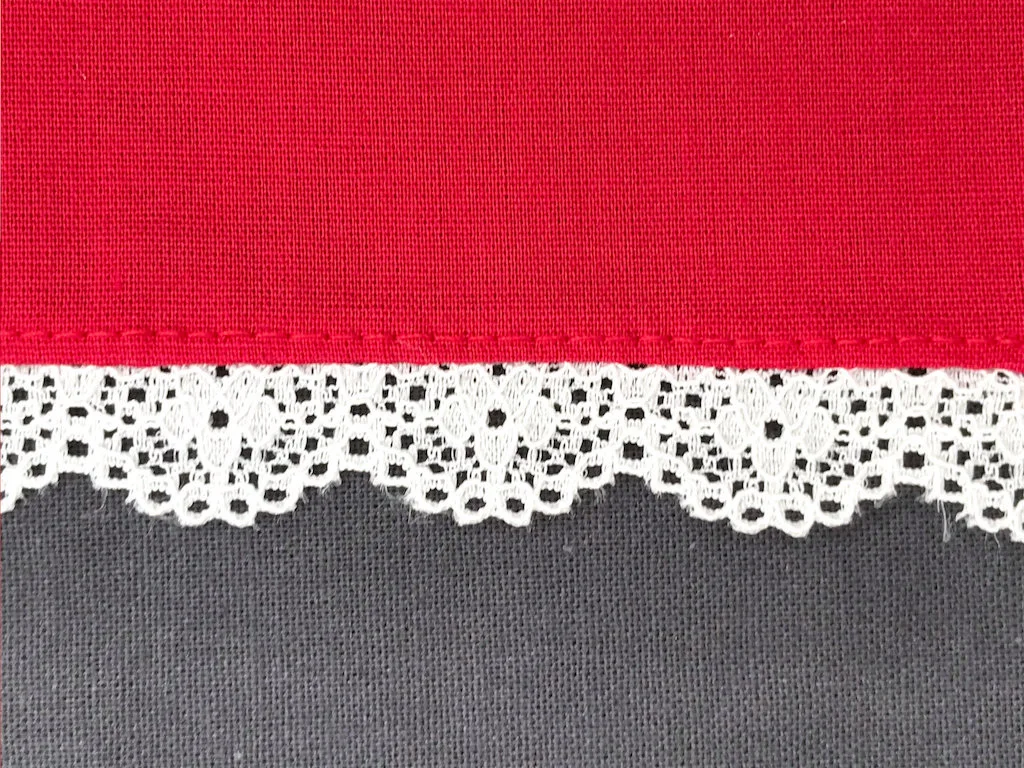 Lace trim nicely sewn to fabric.