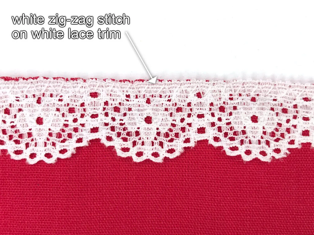Lace trim attached to fabric with a zigzag stitch.