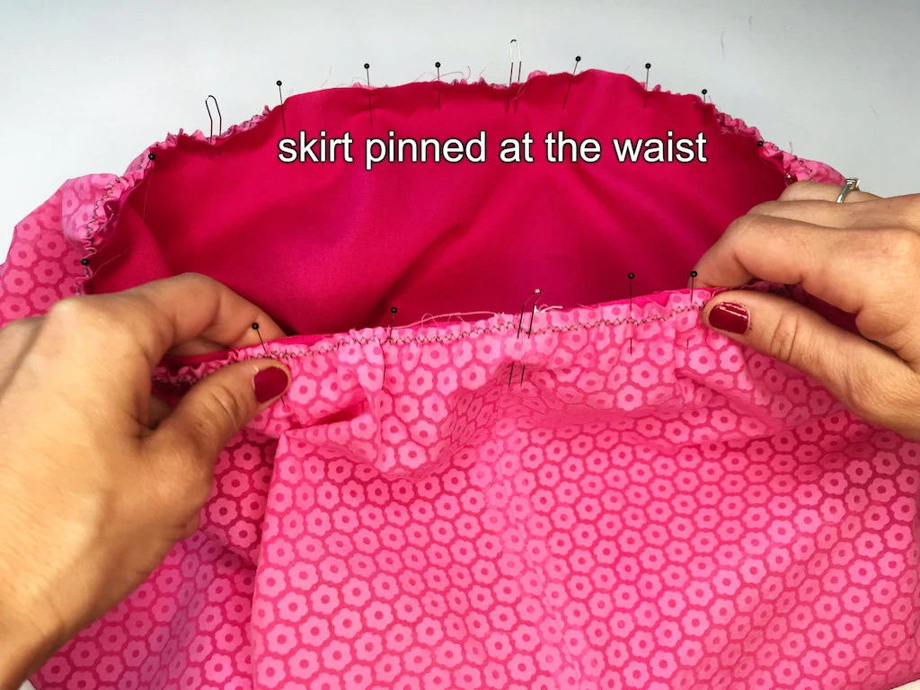 Waist of bubble skirt design fabric and lining pinned together.