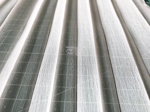 Permanently pleated chiffon fabric. Accordion pleats.
