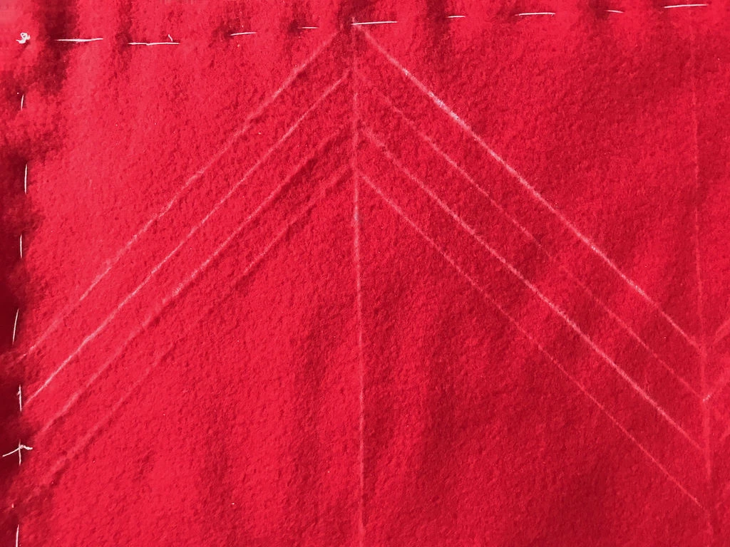 Drawn a pairs of diagonal lines with a quilting ruler.