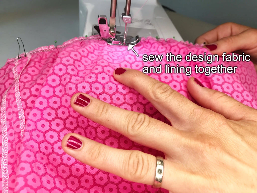 Sewing a design fabric to the lining at the bubble skirt waist.
