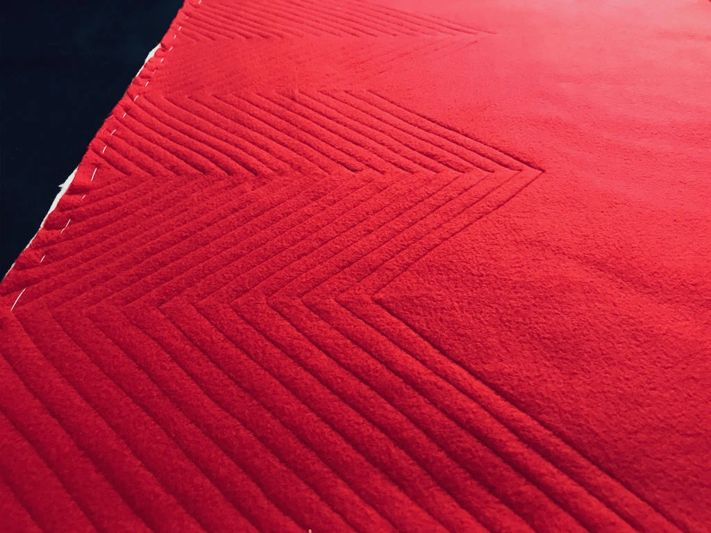 Half of diagonal lines for the pillow front are complete.