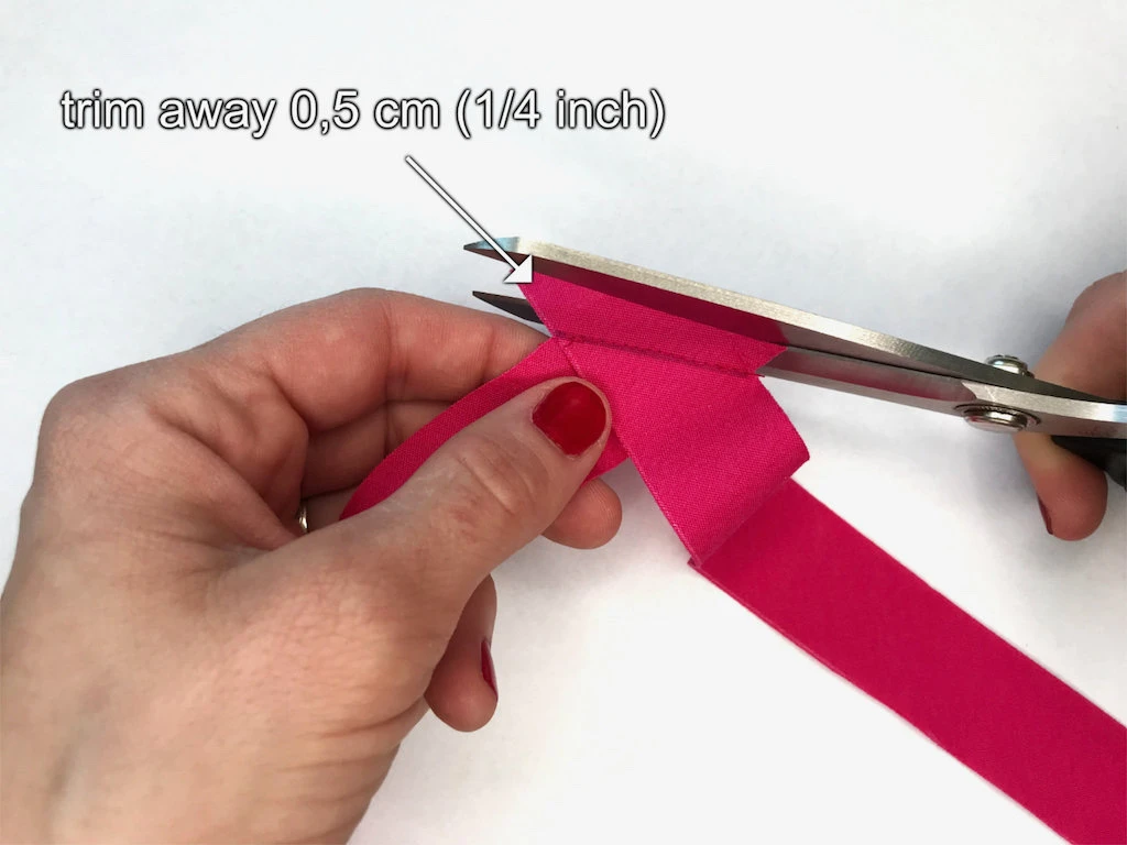 Trimming away extra seam allowance.