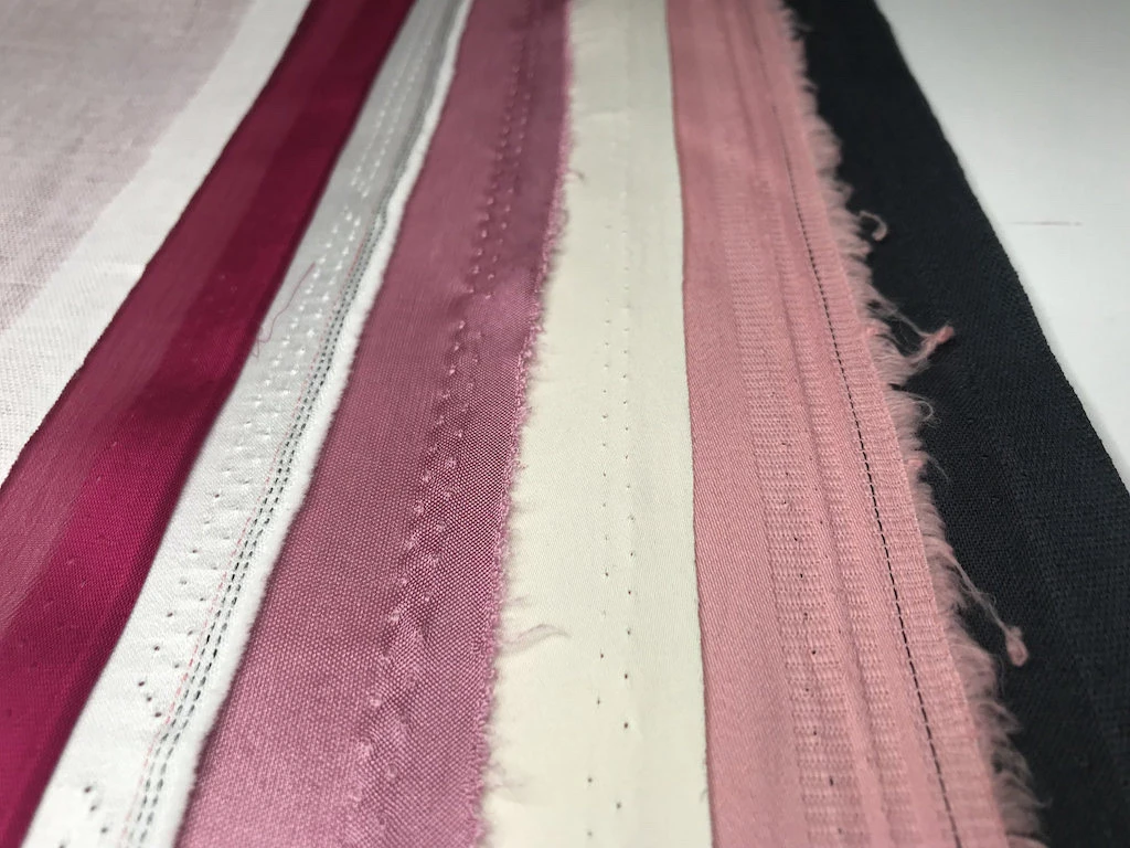 Various selvedge lines of various fabrics.