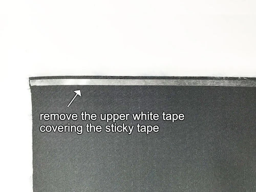 Remove white tape cover from the sticky Wonder tape.