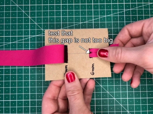 Testing the DIY bias binding tape maker with a stripe of fabric.