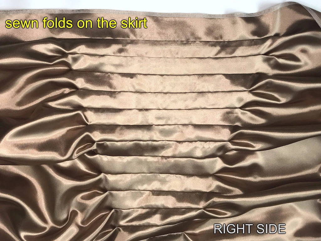 Tuck sew on a Narcissa Malfoy beige dress skirt.