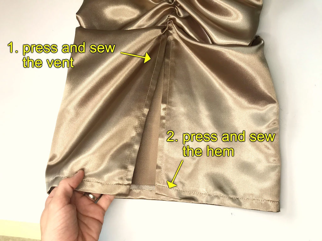 Finished hem allowance on a beige dress.