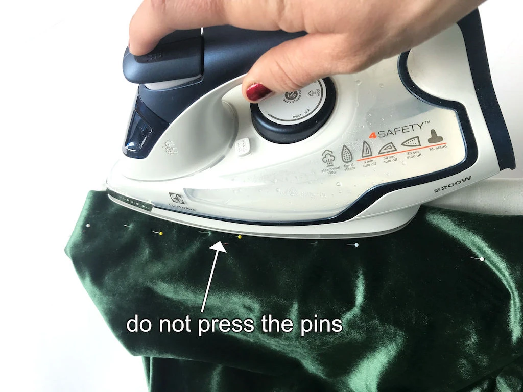 Pressing the elastic waistband casing of Sybill's costume skirt.