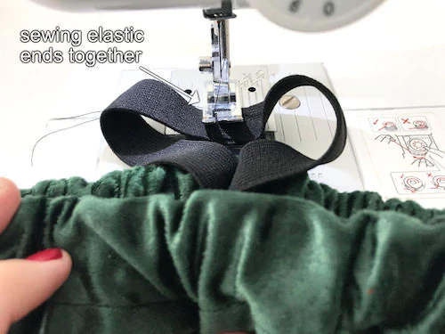 Sewing two ends of an elastic band with a dense zig-zag stitch.